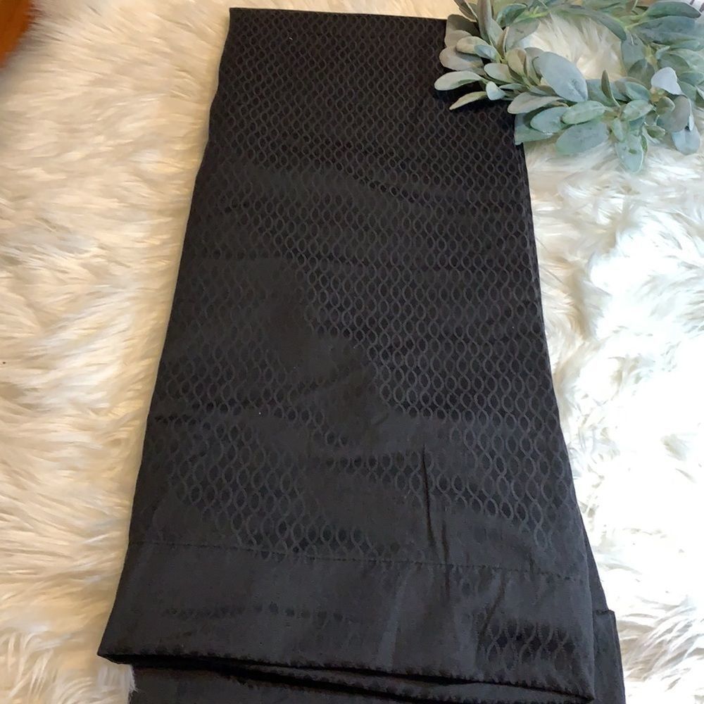 One panel of black (diamond design) black out curtains 50 x 63”